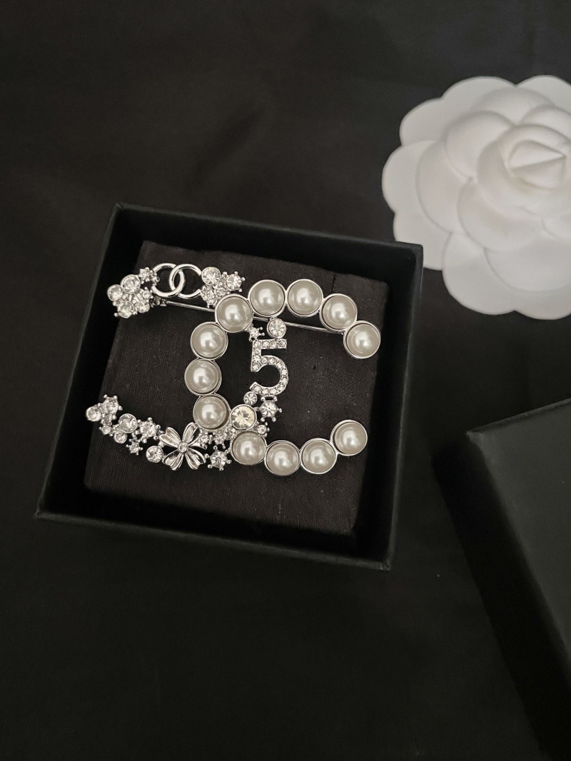 Ch**el brooches